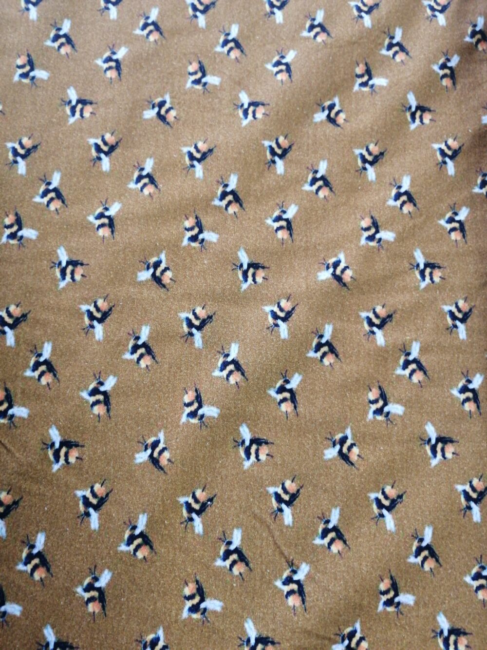 Bees on Mustard cotton jersey fabric by the half metre