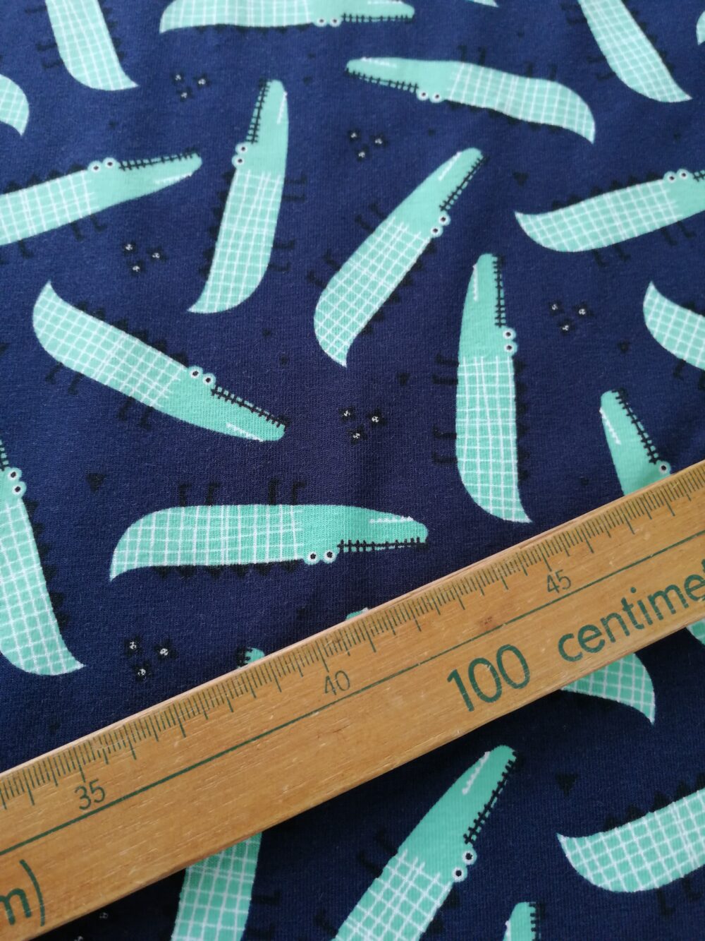 crocodiles on navy cotton jersey fabric by the half metre - Image 2