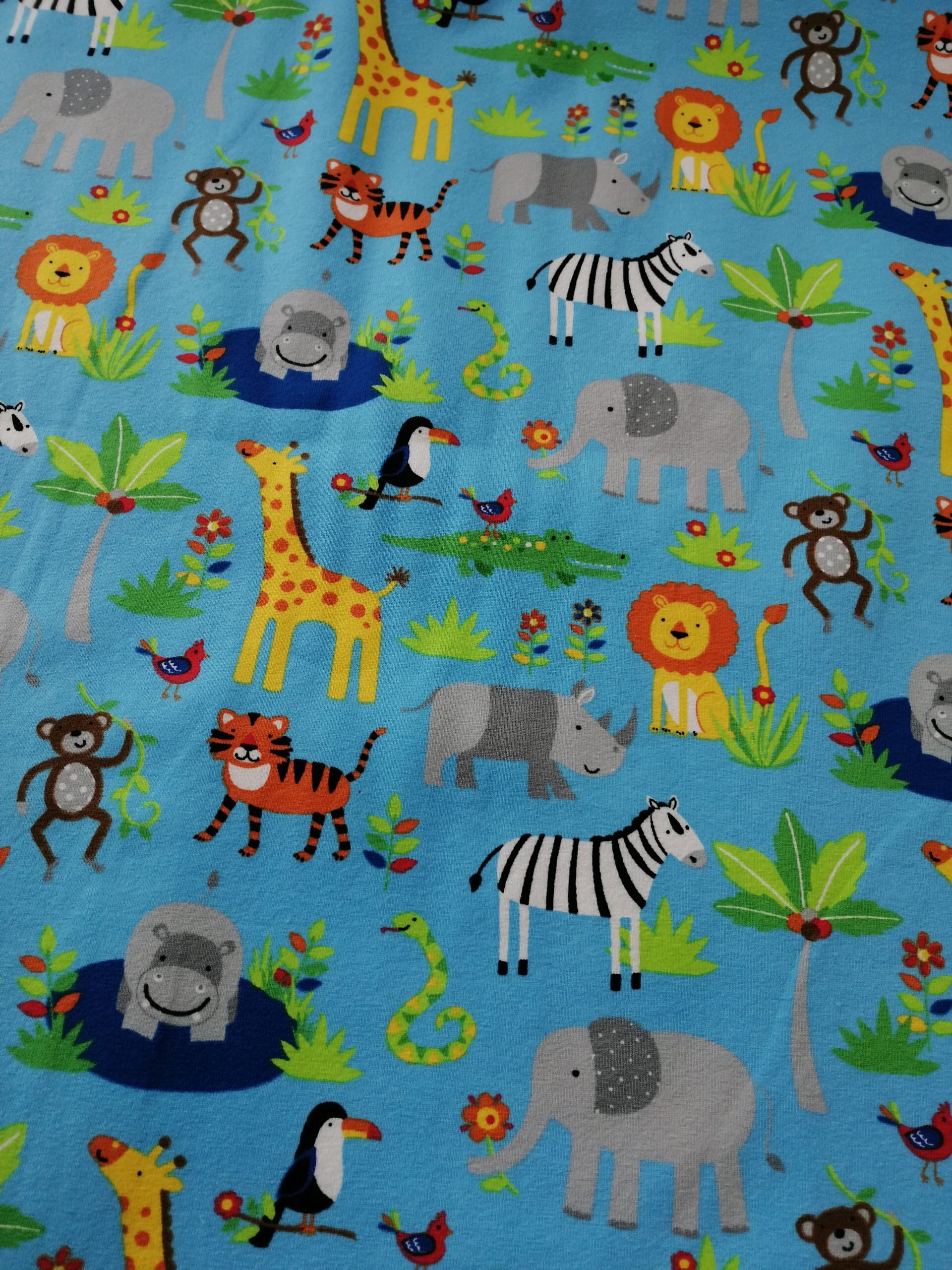 jungle animals cotton jersey fabric on blue by the half metre
