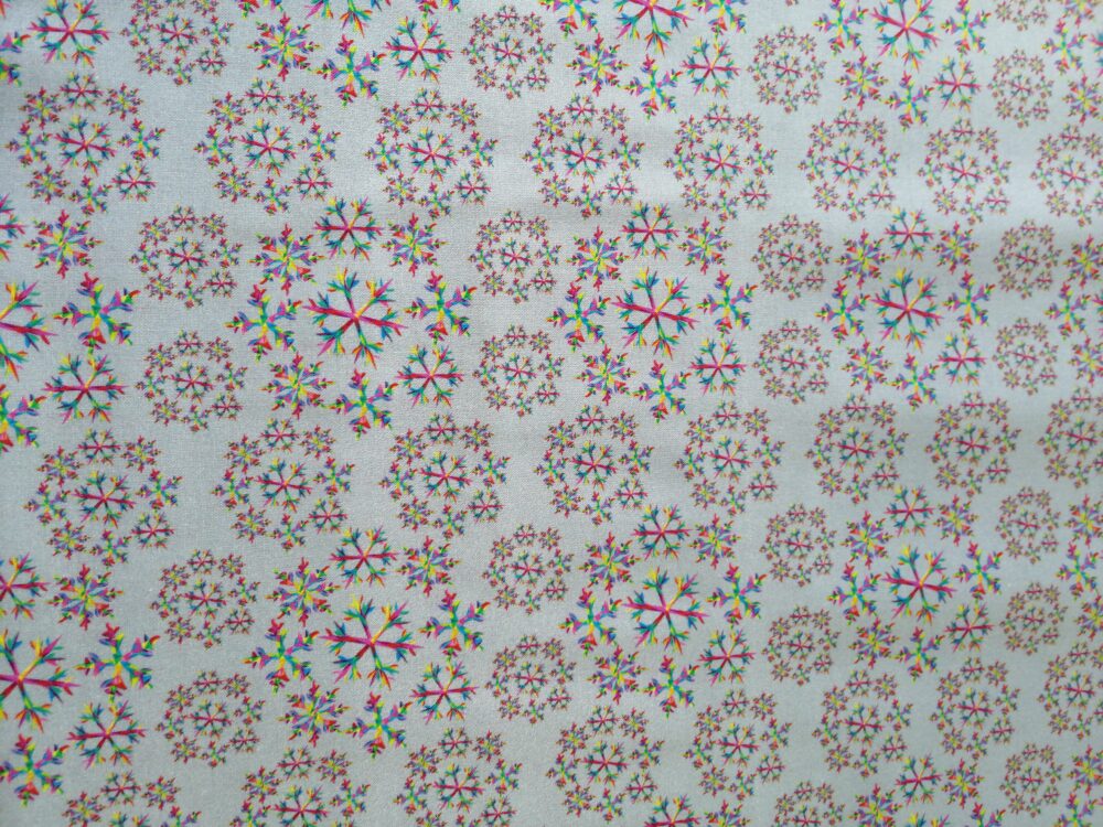 colourful snowfakes cotton fabric by the half metre