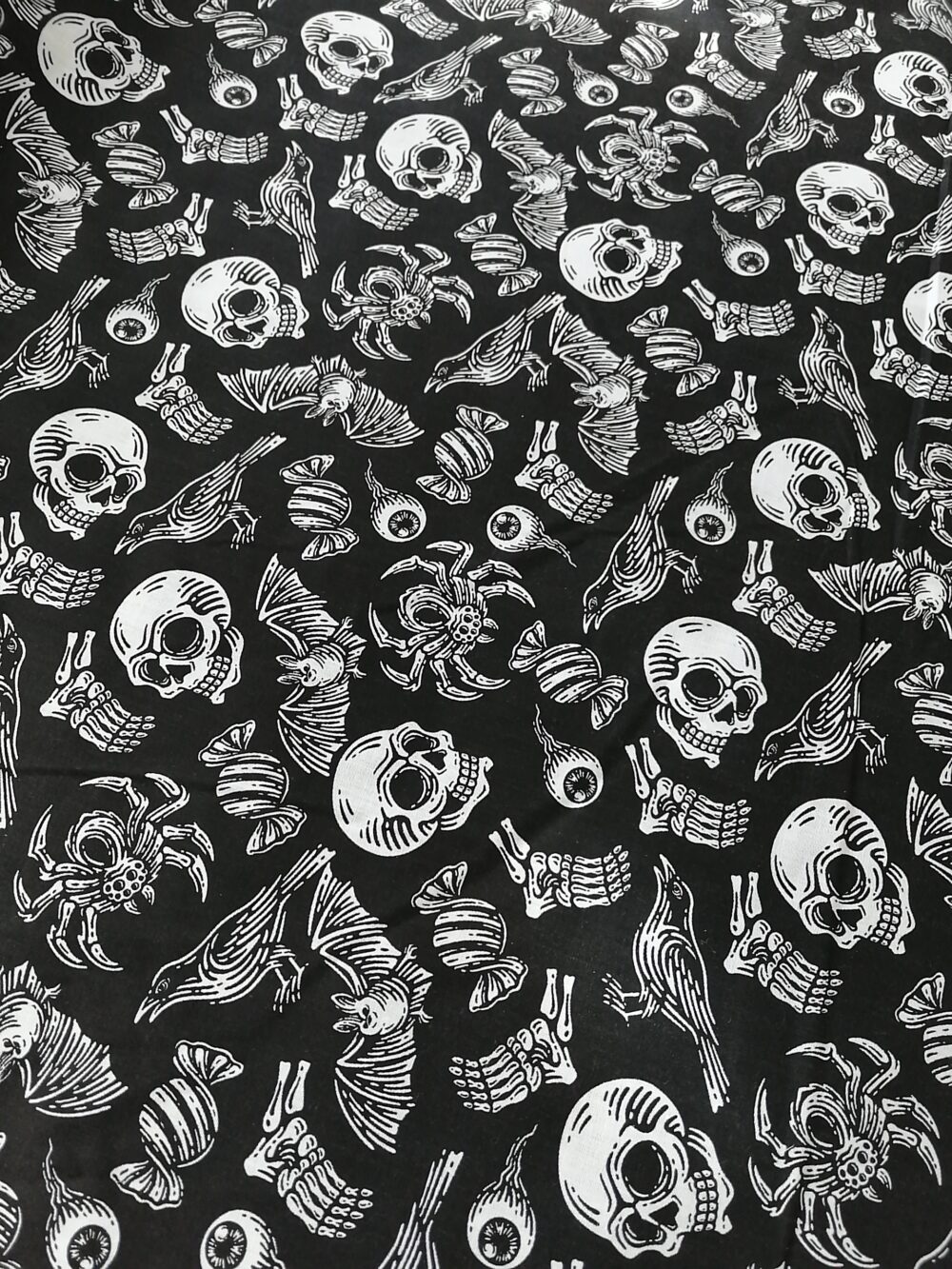 Halloween polycotton fabric Skulls on black