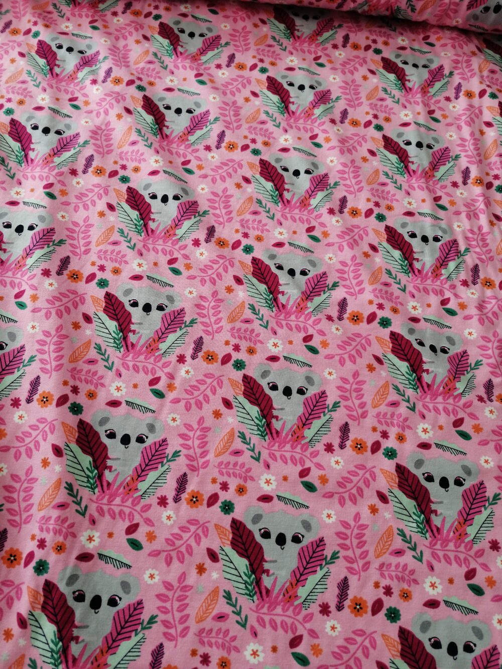 Cute Koalas on pink jersey fabric