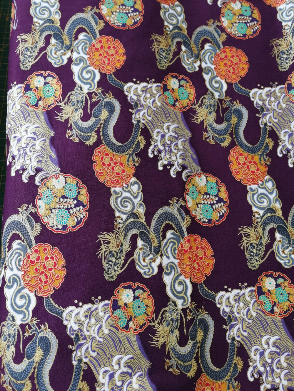 Dragons on plum Japanese cotton fabric