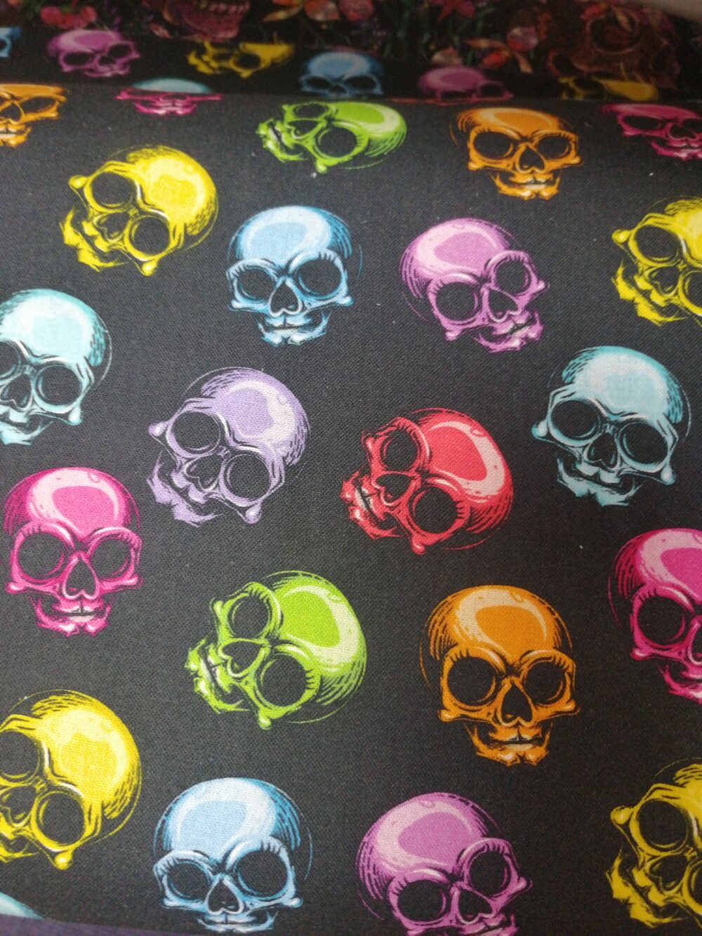 Colourful Skulls on black cotton fabric by the Half Metre