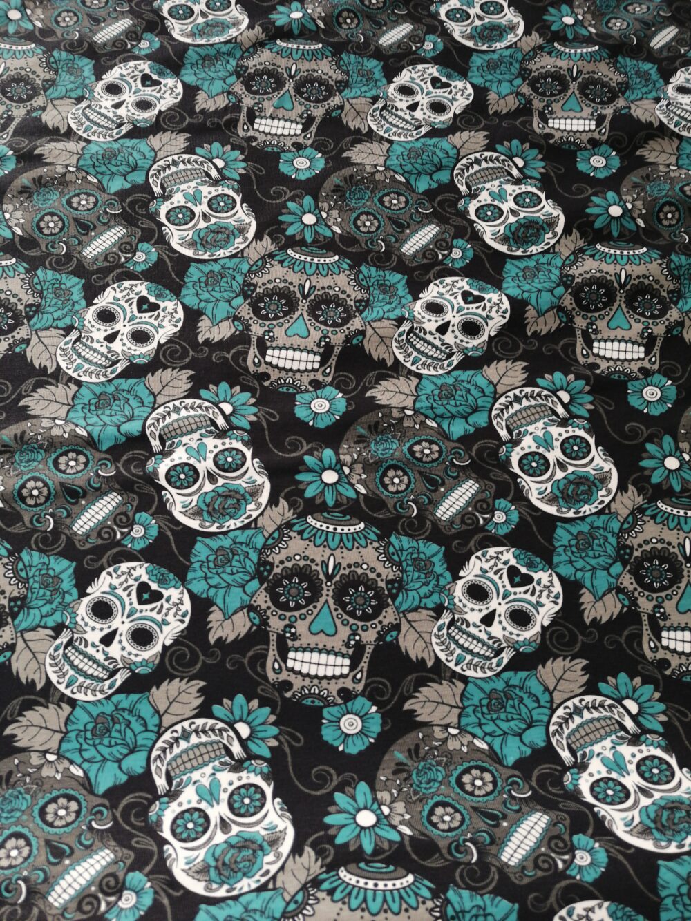 Skulls and Teal roses cotton jersey fabric