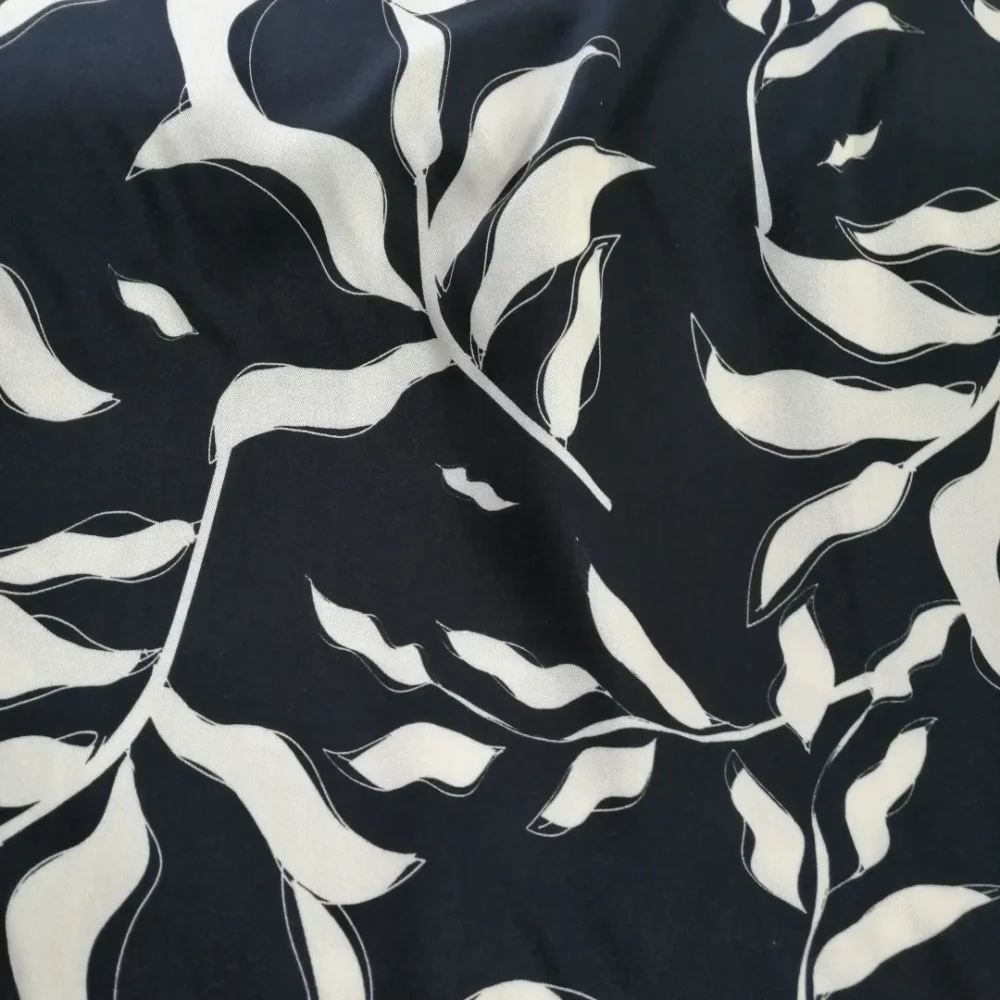 Fern on black viscose twill fabric